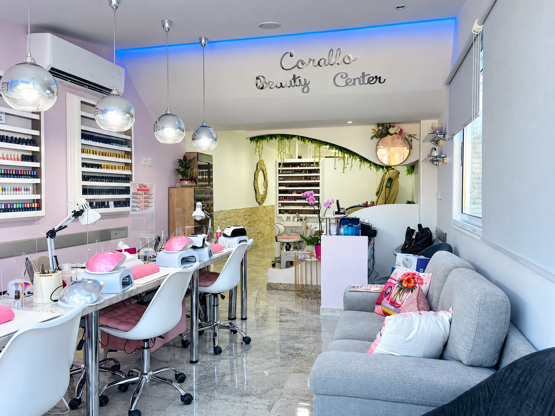 Inside Corallo Beauty Centre: nail tables, the colour wall and the green arch